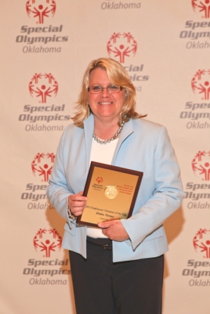 Elaine R. Turner smiles as she holds her award